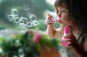 Girl Blowing Soap Bubbles